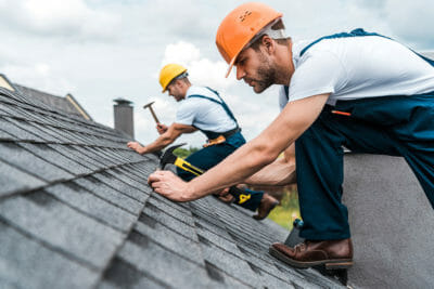 Roofing contractor installing a roof in Denver